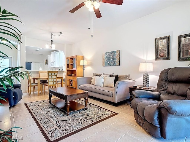 living room featuring light tile patterned floors and ceiling fan