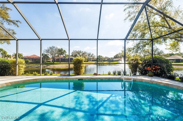 outdoor pool featuring a lanai and a water view