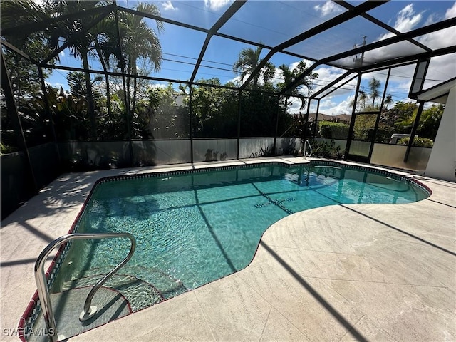 pool with a patio and a lanai