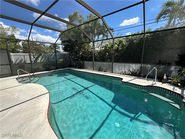 view of swimming pool featuring a fenced in pool, a lanai, a patio, and fence