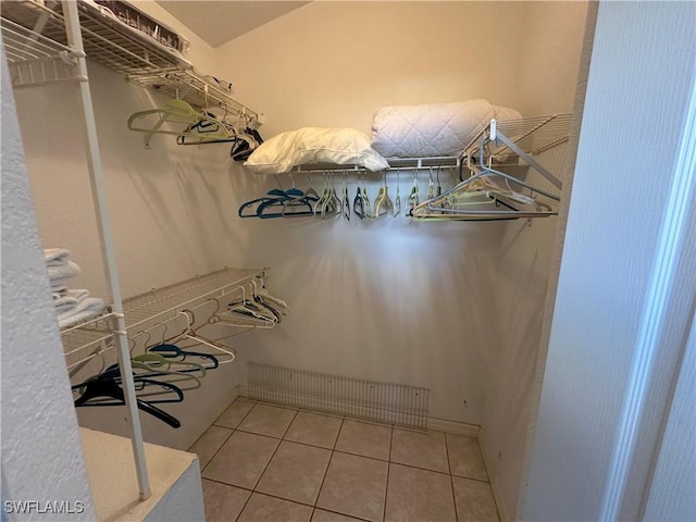 walk in closet featuring tile patterned flooring