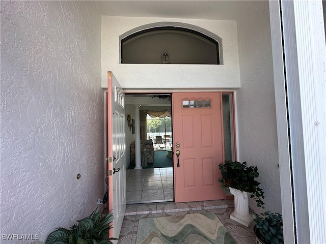 entrance to property with stucco siding