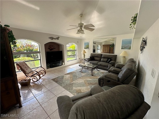 living room featuring light tile patterned floors and a ceiling fan