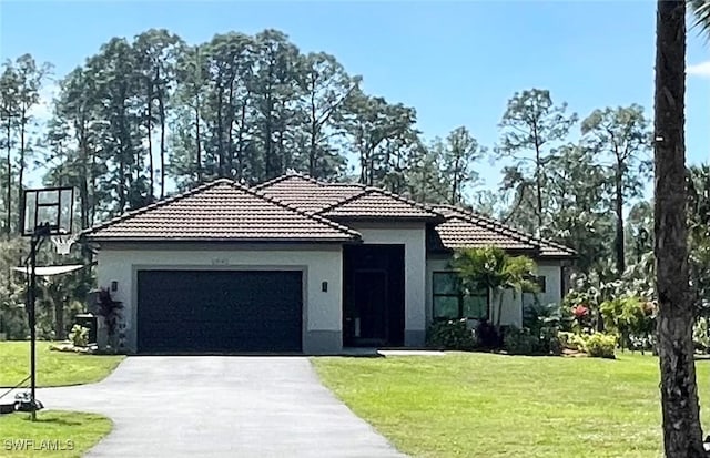 view of front facade featuring aphalt driveway, a tiled roof, a front lawn, and stucco siding