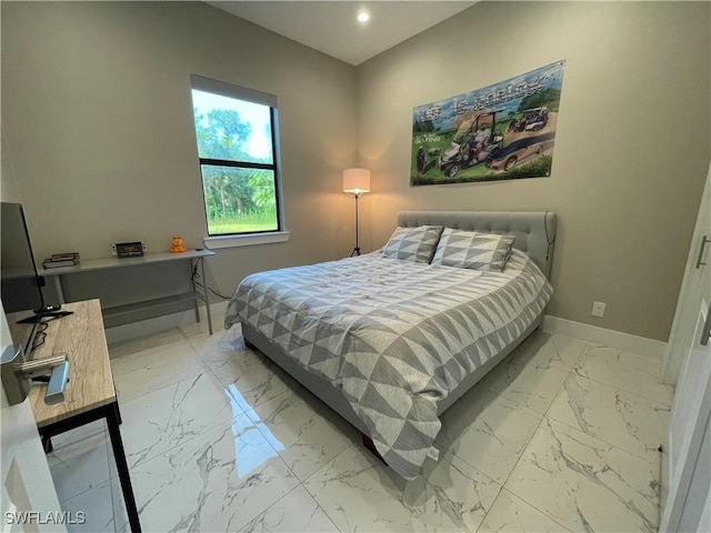 bedroom with recessed lighting, marble finish floor, and baseboards