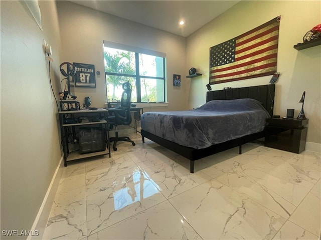 bedroom featuring recessed lighting, marble finish floor, and baseboards