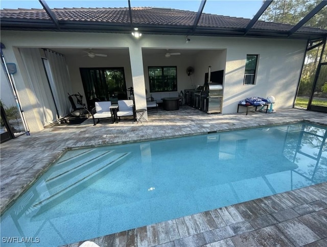 pool featuring a ceiling fan, a lanai, and a patio area