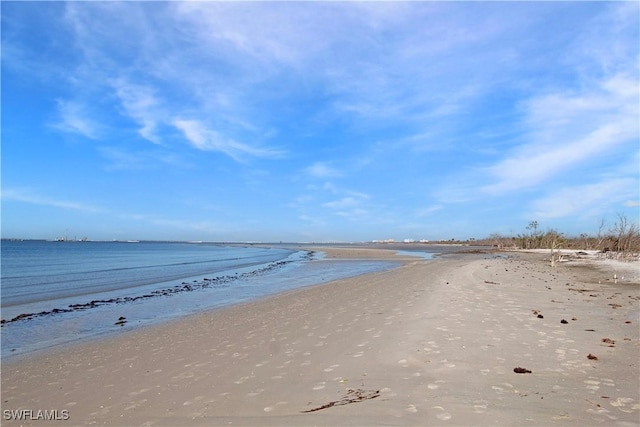 property view of water featuring a beach view