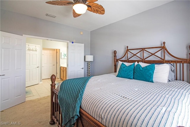 carpeted bedroom with visible vents and a ceiling fan