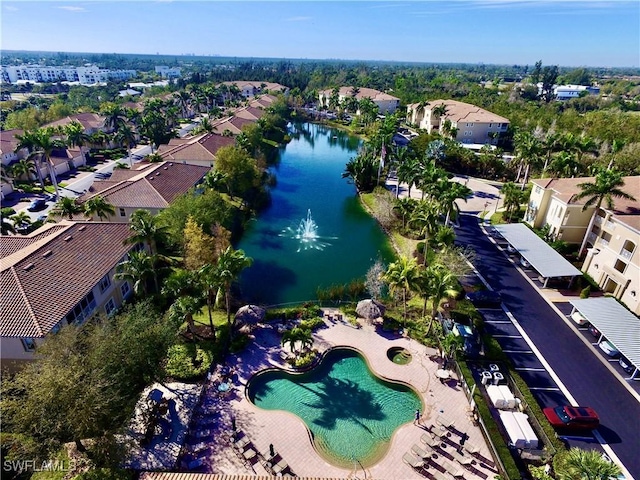 bird's eye view featuring a water view and a residential view