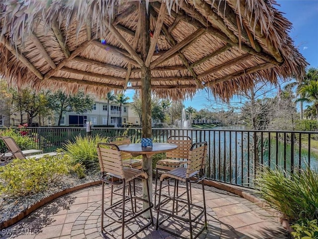 view of patio with outdoor dining space and a gazebo