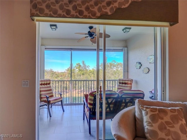 interior space featuring ceiling fan and a healthy amount of sunlight