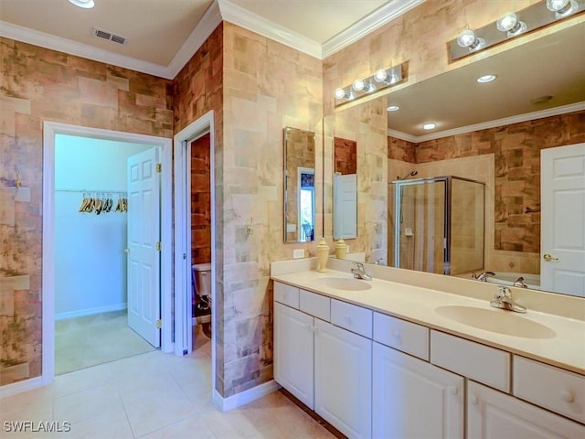 bathroom featuring crown molding, visible vents, a sink, and a shower stall