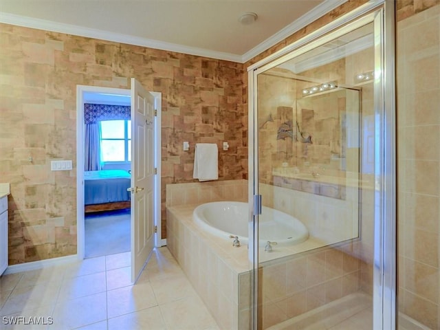 ensuite bathroom featuring a garden tub, ornamental molding, a stall shower, vanity, and tile patterned floors