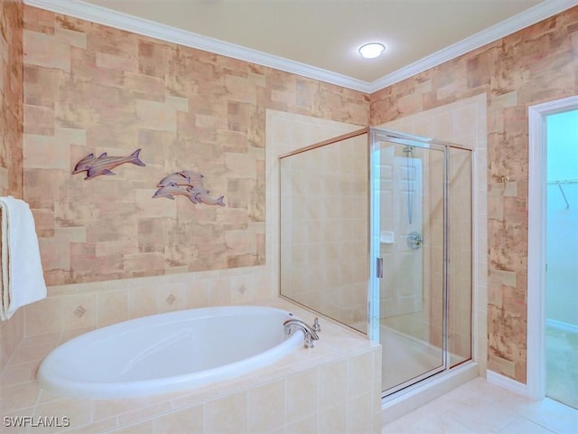 full bathroom featuring tile walls, ornamental molding, a bath, tile patterned floors, and a stall shower