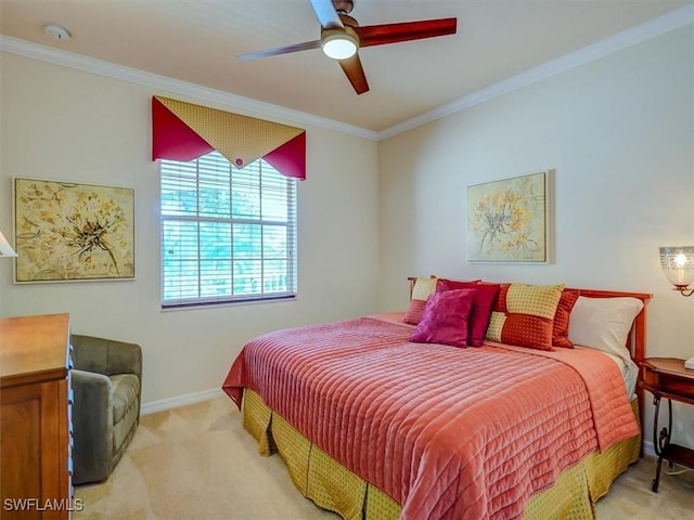 bedroom featuring light carpet, ceiling fan, baseboards, and crown molding