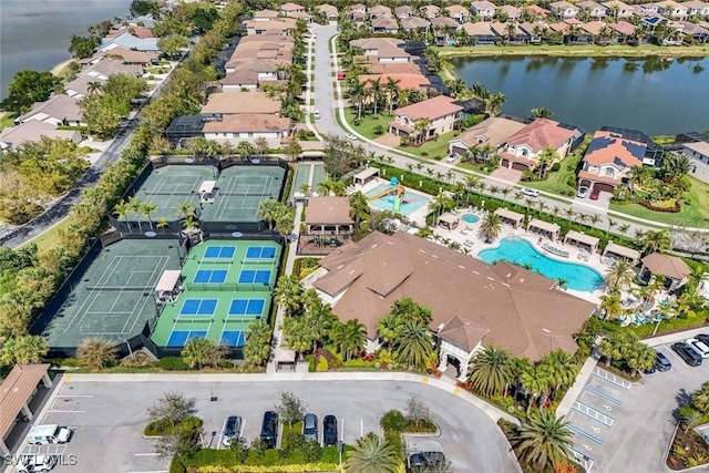 birds eye view of property with a residential view and a water view