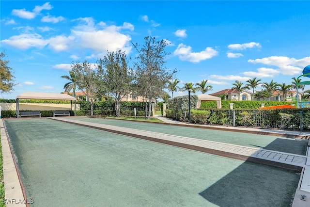 view of home's community with fence