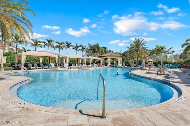 community pool featuring a patio and a gazebo