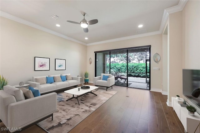 living area featuring dark wood finished floors, recessed lighting, visible vents, ornamental molding, and baseboards