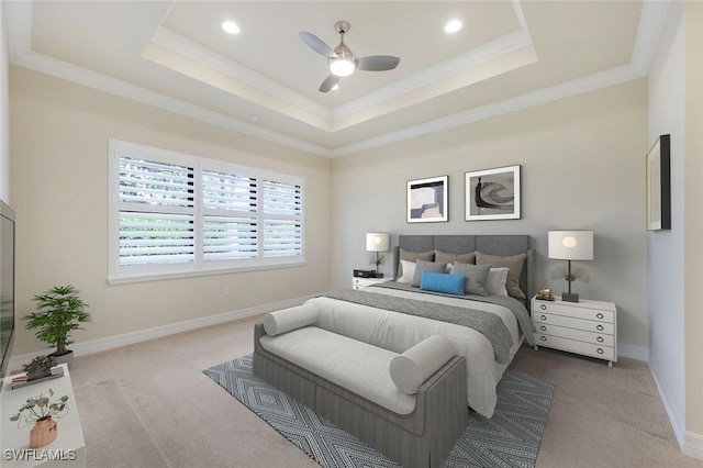 carpeted bedroom with ornamental molding, recessed lighting, a raised ceiling, and baseboards