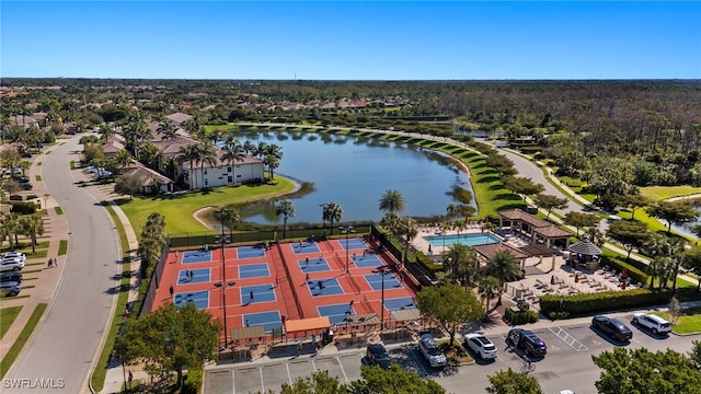 birds eye view of property with a water view