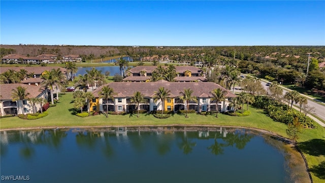 bird's eye view featuring a water view and a residential view