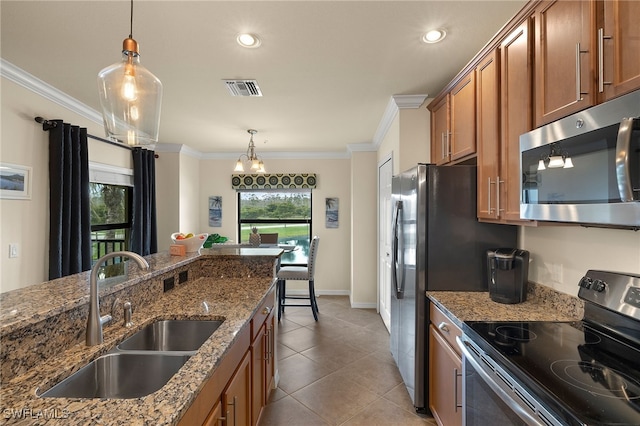 kitchen featuring crown molding, stainless steel appliances, visible vents, brown cabinetry, and a sink