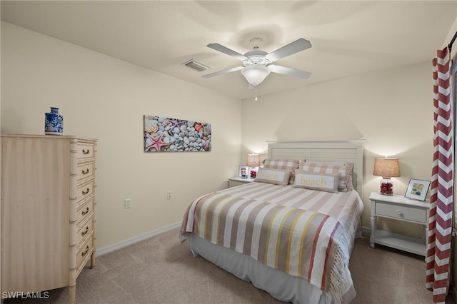 carpeted bedroom with ceiling fan, visible vents, and baseboards