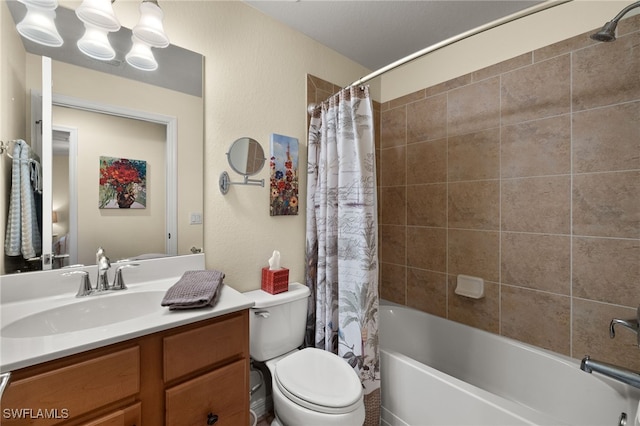 bathroom with toilet, a textured wall, shower / bath combo with shower curtain, and vanity