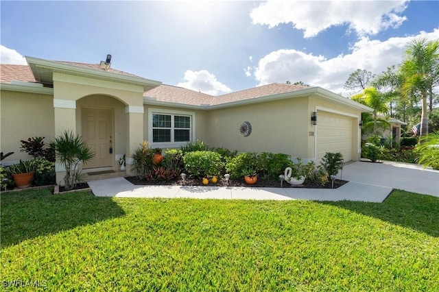 view of front of home featuring driveway, a front lawn, an attached garage, and stucco siding