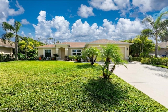 view of front facade featuring a garage, driveway, a front lawn, and stucco siding