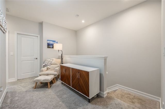 living area with recessed lighting, carpet flooring, and baseboards