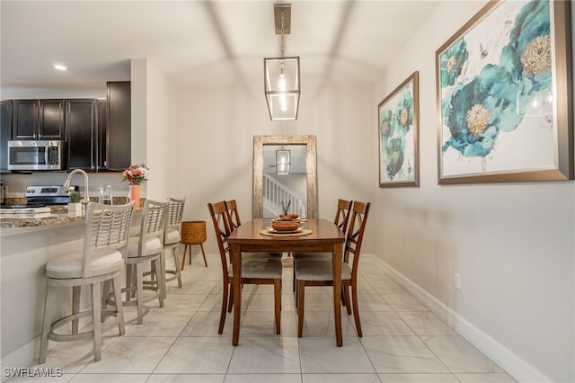 dining space featuring recessed lighting and baseboards