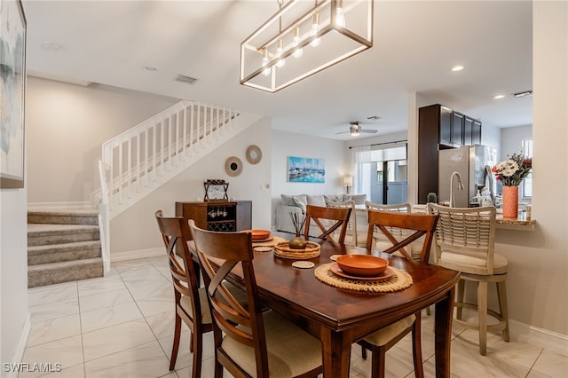 dining space with marble finish floor, recessed lighting, visible vents, baseboards, and stairs