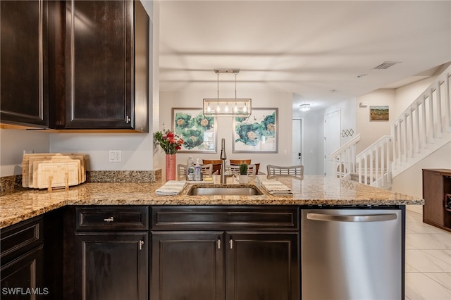 kitchen featuring light stone counters, a peninsula, a sink, visible vents, and stainless steel dishwasher