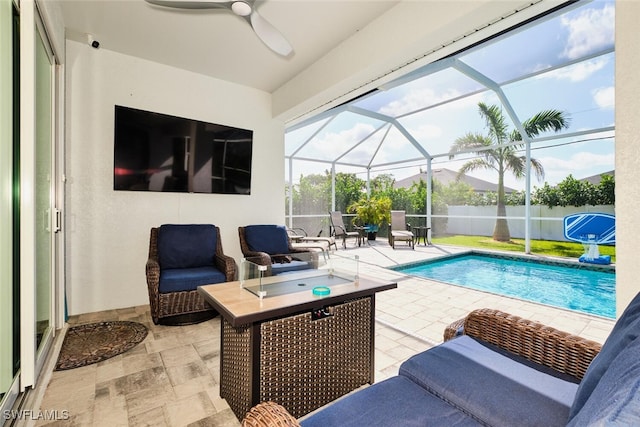 view of swimming pool featuring a fenced in pool, ceiling fan, a lanai, fence, and a patio area