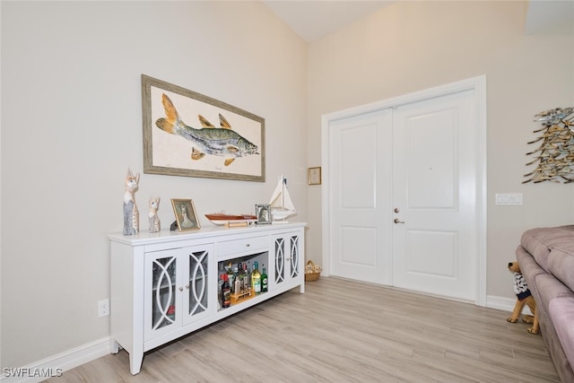 interior space featuring light wood-style floors and baseboards