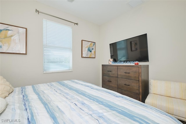 bedroom featuring visible vents