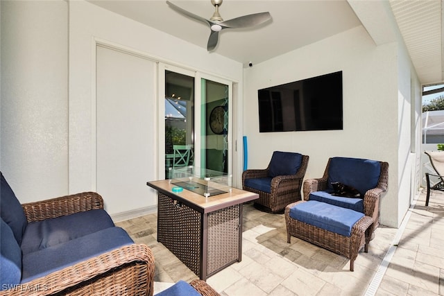 view of patio with an outdoor living space and a ceiling fan