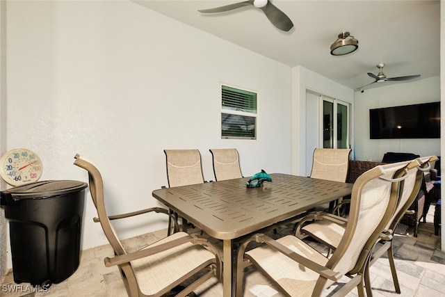 view of patio / terrace featuring a ceiling fan and outdoor dining space