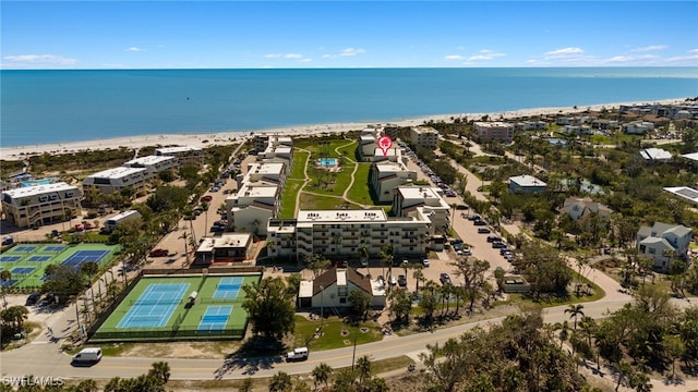 drone / aerial view featuring a water view and a beach view