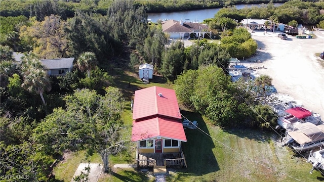 drone / aerial view with a water view