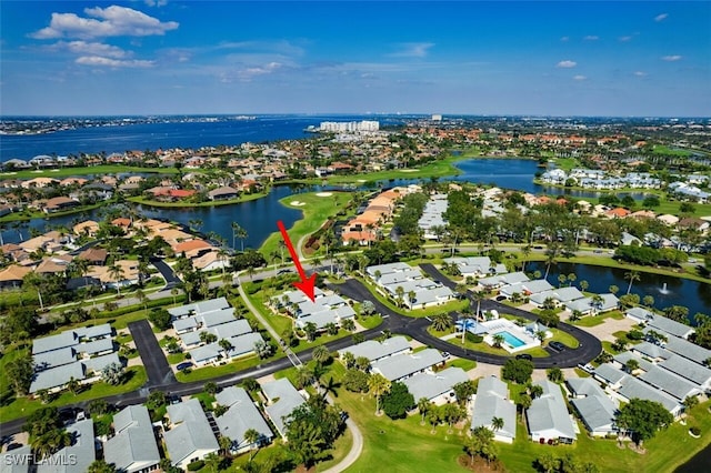 bird's eye view with a residential view and a water view