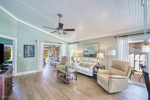 living room featuring baseboards, a ceiling fan, lofted ceiling, wood finished floors, and crown molding