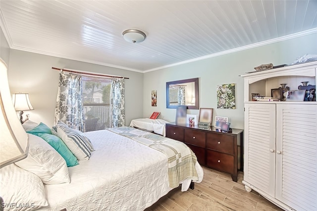 bedroom with light wood finished floors, wood ceiling, and ornamental molding