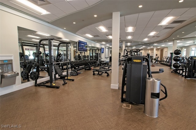 gym featuring a paneled ceiling