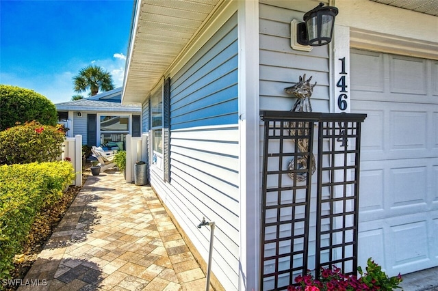 view of side of property featuring a garage