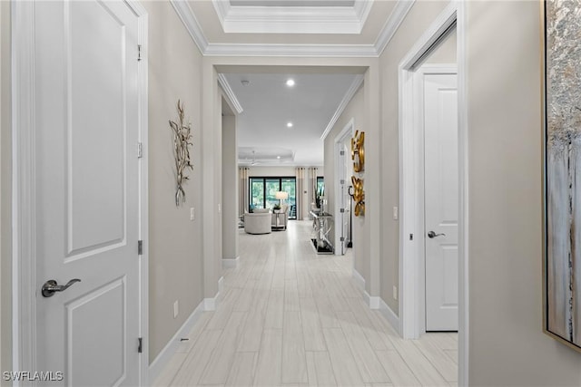 corridor with ornamental molding, recessed lighting, and baseboards