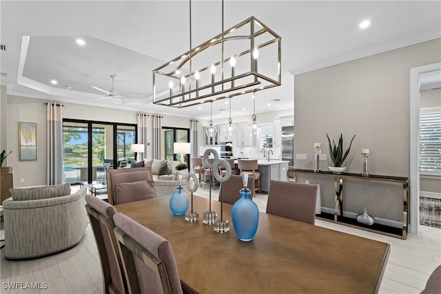 dining area featuring recessed lighting, light wood-style flooring, a ceiling fan, and crown molding